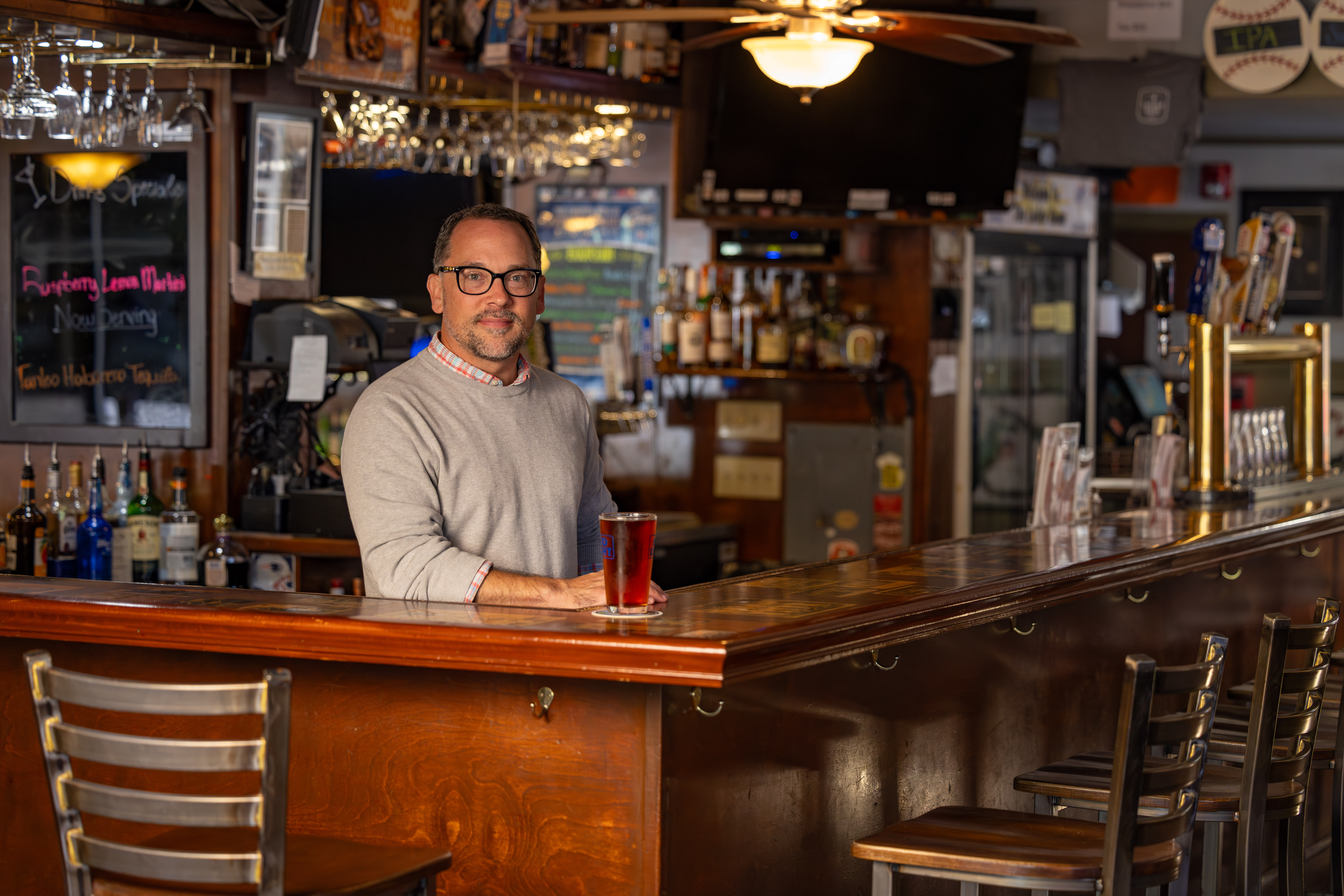 rick methe owner of the locker room in lee massachusetts posing at his bar